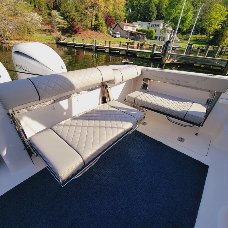 Slide: The Image of 2023 Pursuit OS 325 Offshore boat with foldable seating and elegant interior design. - 17