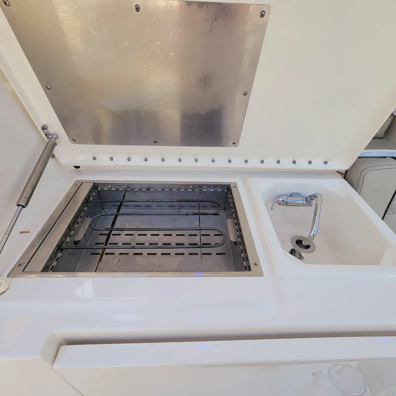 Slide: The Image of Outdoor kitchen setup on 2023 Pursuit OS 325 Offshore boat. - 19