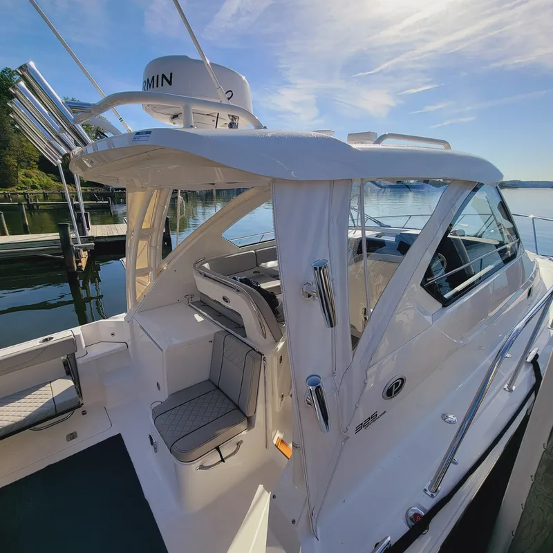 Slide: The Image of 2023 Pursuit OS 325 Offshore boat docked, showcasing sleek design and modern features. - 3