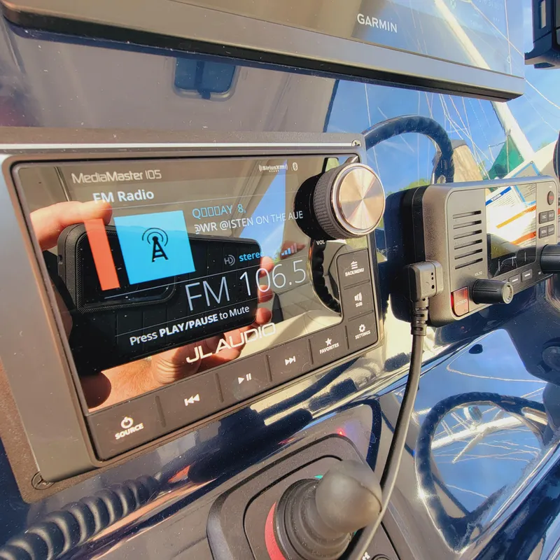 Slide: The Image of 2023 Pursuit OS 325 Offshore dashboard with JL Audio MediaMaster 105 and Garmin display. - 34