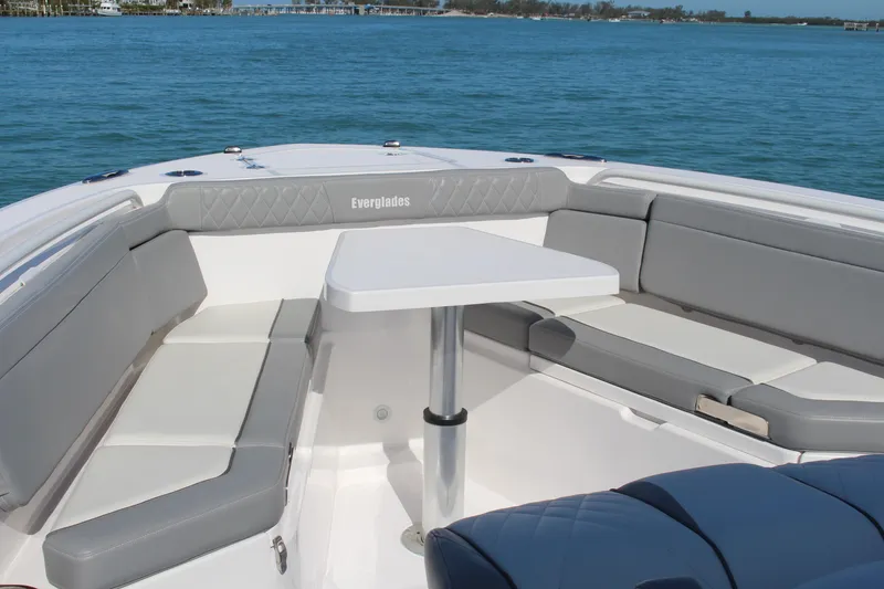 Slide: The Image of 2024 Everglades 395 Center Console boat with luxurious seating on a sunny day. - 12