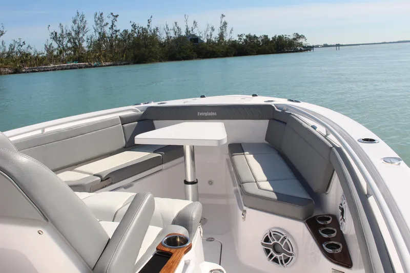 Slide: The Image of 2024 Everglades 395 Center Console boat interior with seating and cup holders. - 14