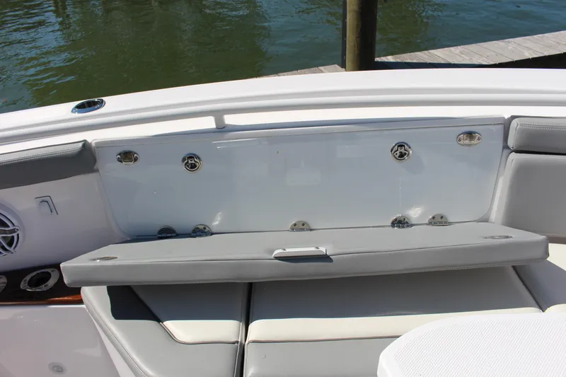 Slide: The Image of 2024 Everglades 395 Center Console boat seating with open storage compartment. - 22