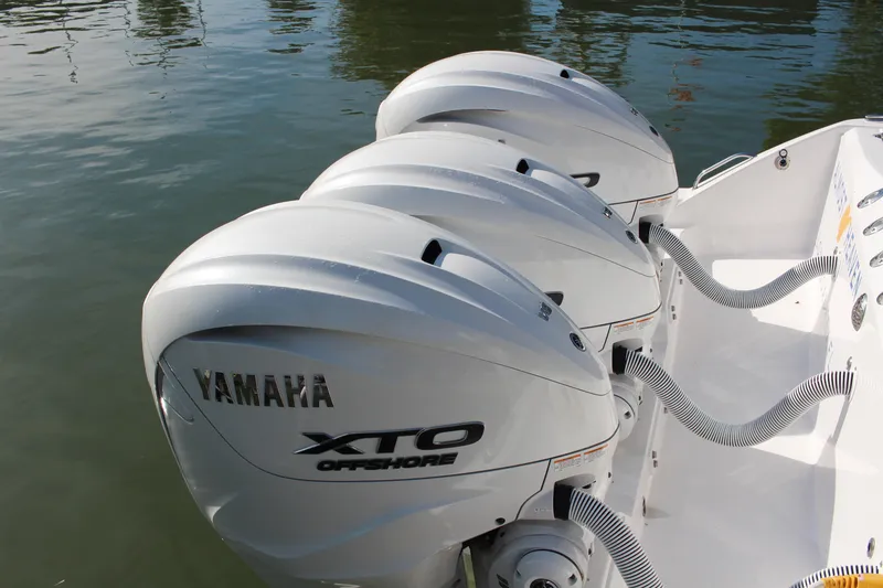 Slide: The Image of 2024 Everglades 395 Center Console boat seating area with cushioned bench and sleek design. - 23