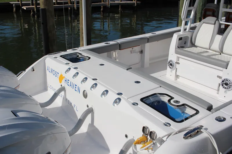 Slide: The Image of 2024 Everglades 395 Center Console boat deck with quilted seating detail. - 26