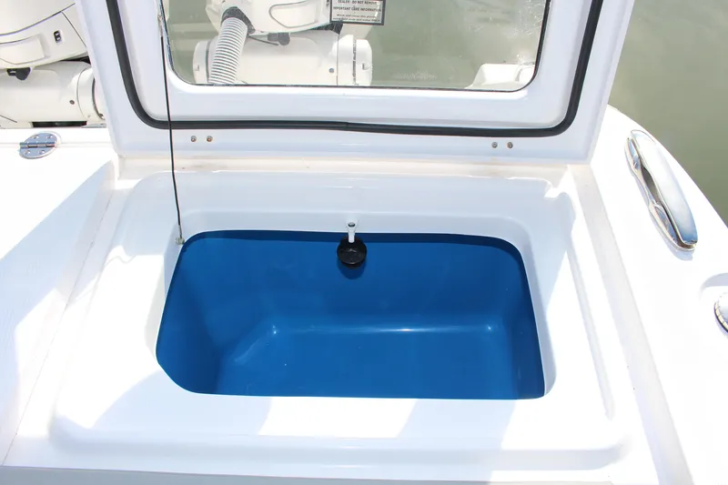Slide: The Image of 2024 Everglades 395 Center Console boat interior with seating and fishing equipment. - 27