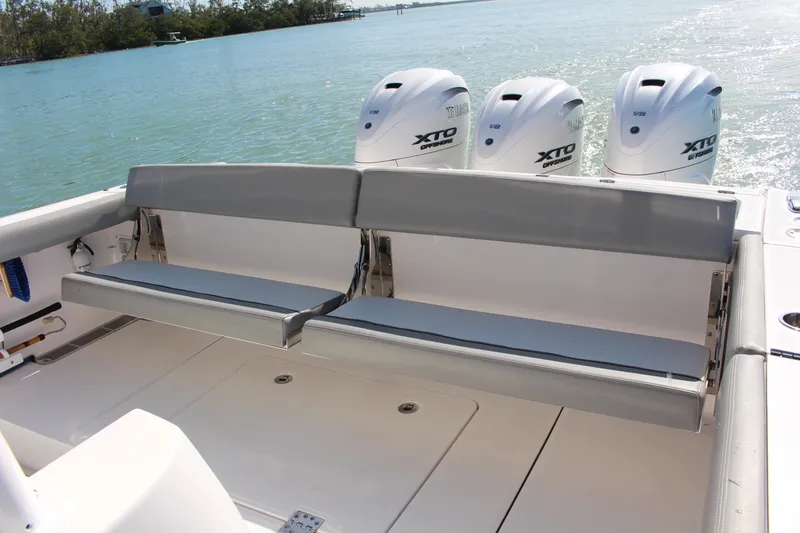 Slide: The Image of 2024 Everglades 395 Center Console livewell with blue interior and open lid. - 28