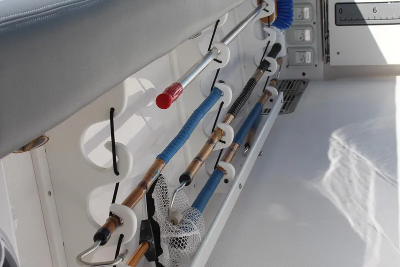 Slide: The Image of 2024 Everglades 395 Center Console boat seating with white and gray cushions. - 31