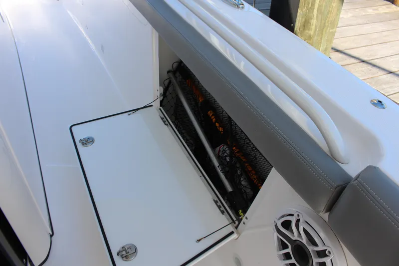 Slide: The Image of 2024 Everglades 395 Center Console fishing rod holders and storage area. - 32