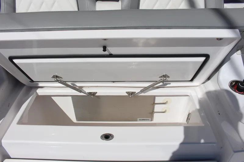 Slide: The Image of 2024 Everglades 395 Center Console boat with open storage compartment and speakers. - 36