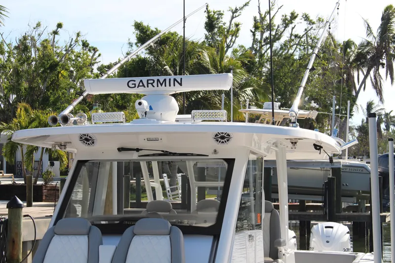 Slide: The Image of 2024 Everglades 395 Center Console dashboard with advanced navigation displays and controls. - 6