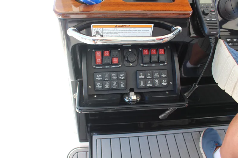 Slide: The Image of 2024 Everglades 395 Center Console dashboard with advanced navigation displays and controls. - 8