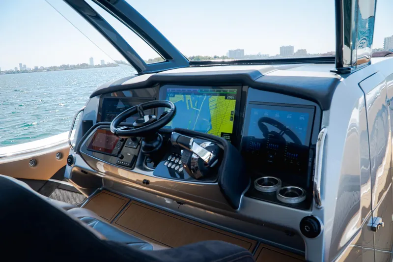Slide: The Image of Helm of 2022 MTI V50 boat with advanced navigation system and steering wheel. - 11