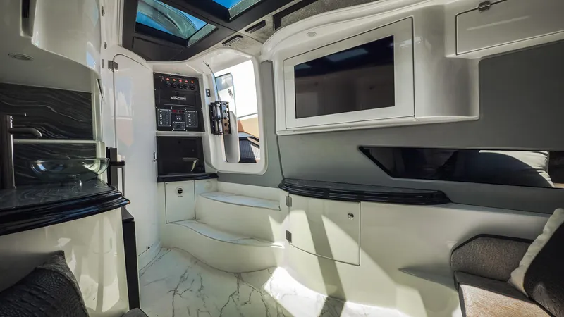 Slide: The Image of Luxurious interior of 2022 MTI V50 boat with modern amenities and sleek design. - 32