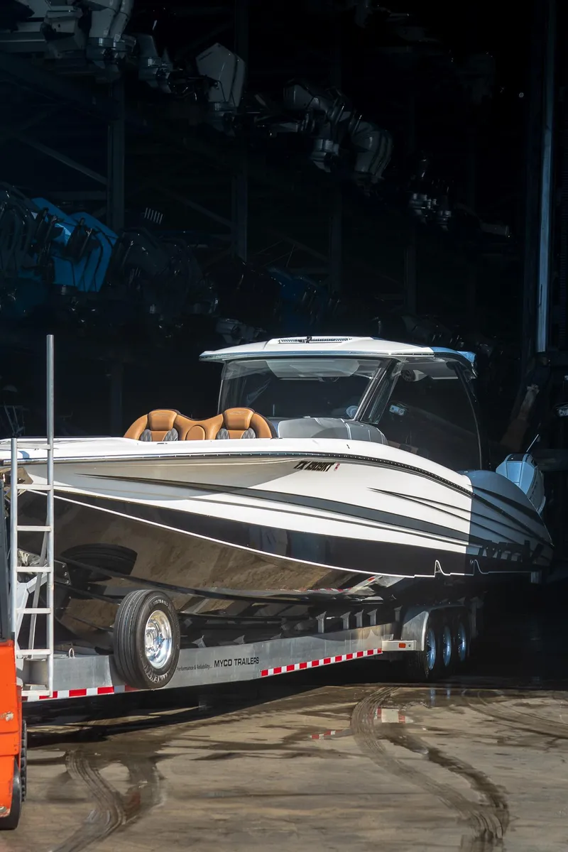 Slide: The Image of 2022 MTI V50 boat on trailer in storage facility. - 34