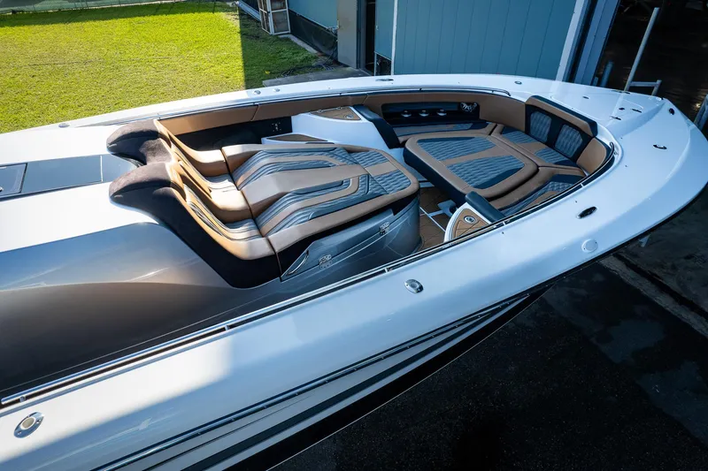 Slide: The Image of 2022 MTI V50 boat with luxurious seating and sleek design. - 42