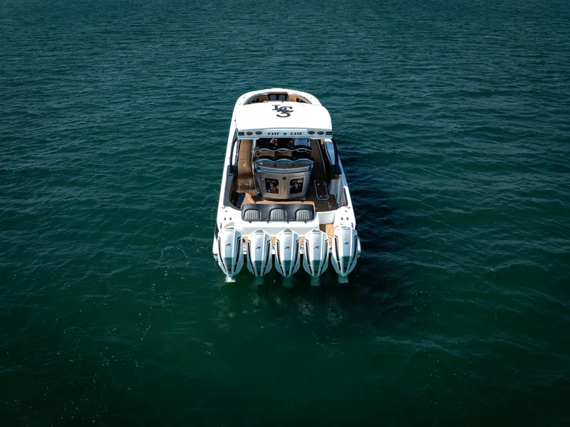 Slide: The Image of Aerial view of 2022 MTI V50 boat with multiple engines on open water. - 7