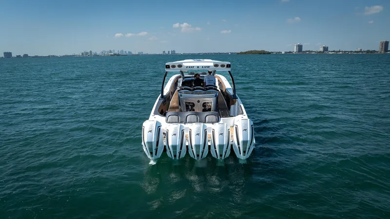 Slide: The Image of Luxury MTI V50 boat with five engines cruising on open water, 2022 model. - 8