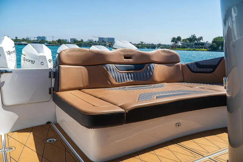 Slide: The Image of Luxurious seating on MTI V50 boat, 2022 model, with scenic waterfront view. - 9