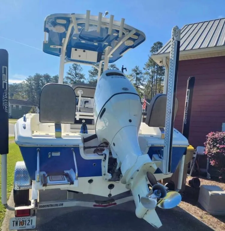 Slide: The Image of 2022 Sea Pro 199 Deep V Center Console boat with outboard motor, parked on a trailer. - 3