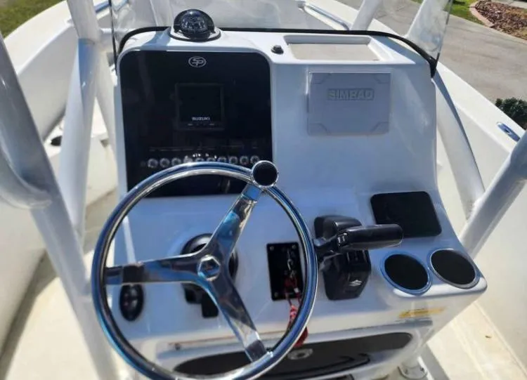 Slide: The Image of 2022 Sea Pro 199 Deep V Center Console dashboard with steering wheel and controls. - 6