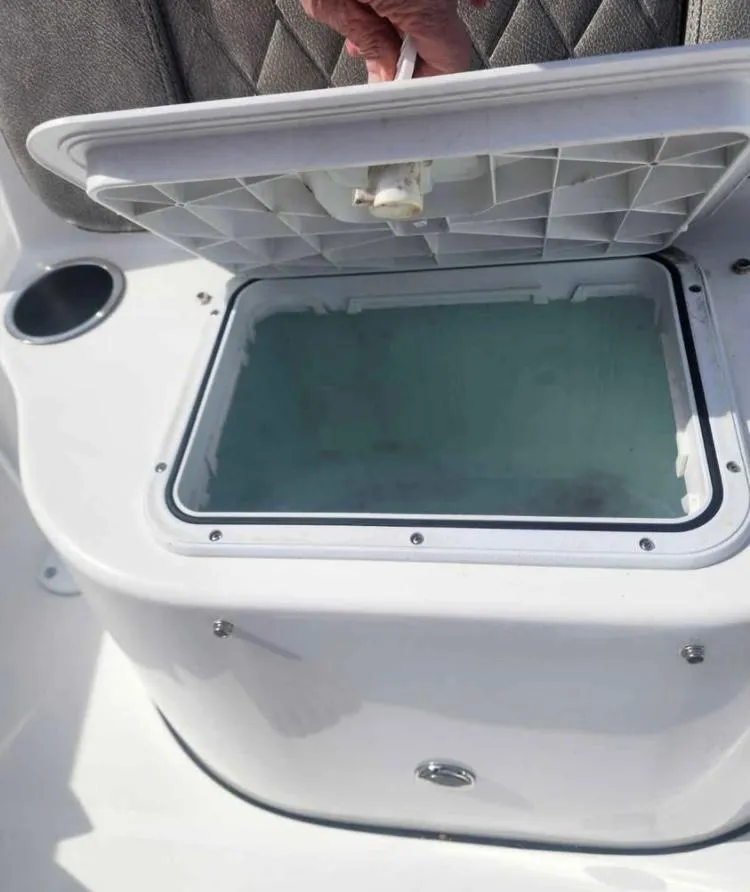 Slide: The Image of Open storage compartment on 2022 Sea Pro 199 Deep V Center Console boat. - 8