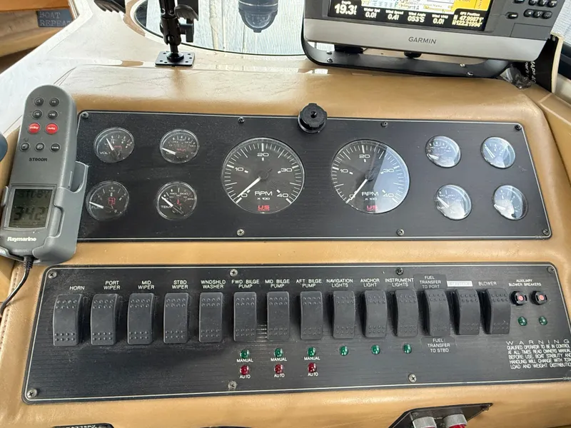 Slide: The Image of Control panel of a 2002 Bayliner 4087 Aft Cabin Motoryacht with gauges and switches. - 10