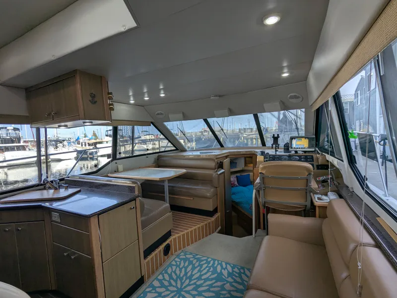 Slide: The Image of Interior of 2002 Bayliner 4087 Aft Cabin Motoryacht with seating and navigation area. - 27