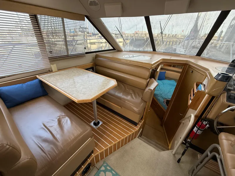 Slide: The Image of Interior of 2002 Bayliner 4087 Aft Cabin Motoryacht with seating and table. - 3
