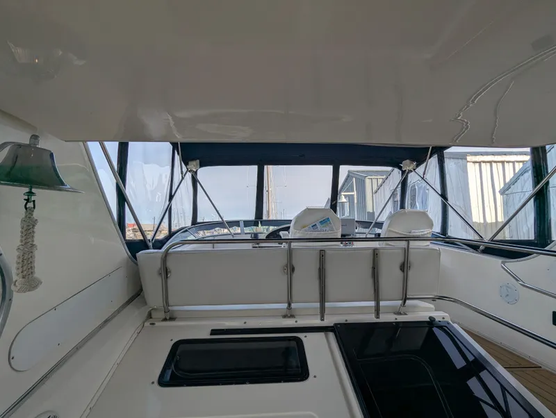 Slide: The Image of 2002 Bayliner 4087 Aft Cabin Motoryacht interior with seating and helm station. - 30