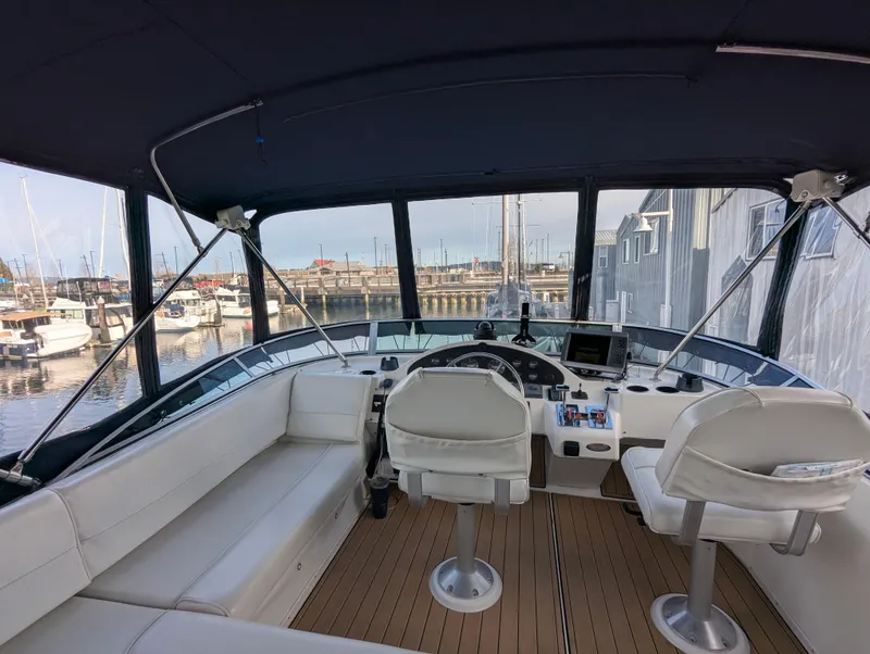 Slide: The Image of Interior view of 2002 Bayliner 4087 Aft Cabin Motoryacht with helm and seating area. - 32