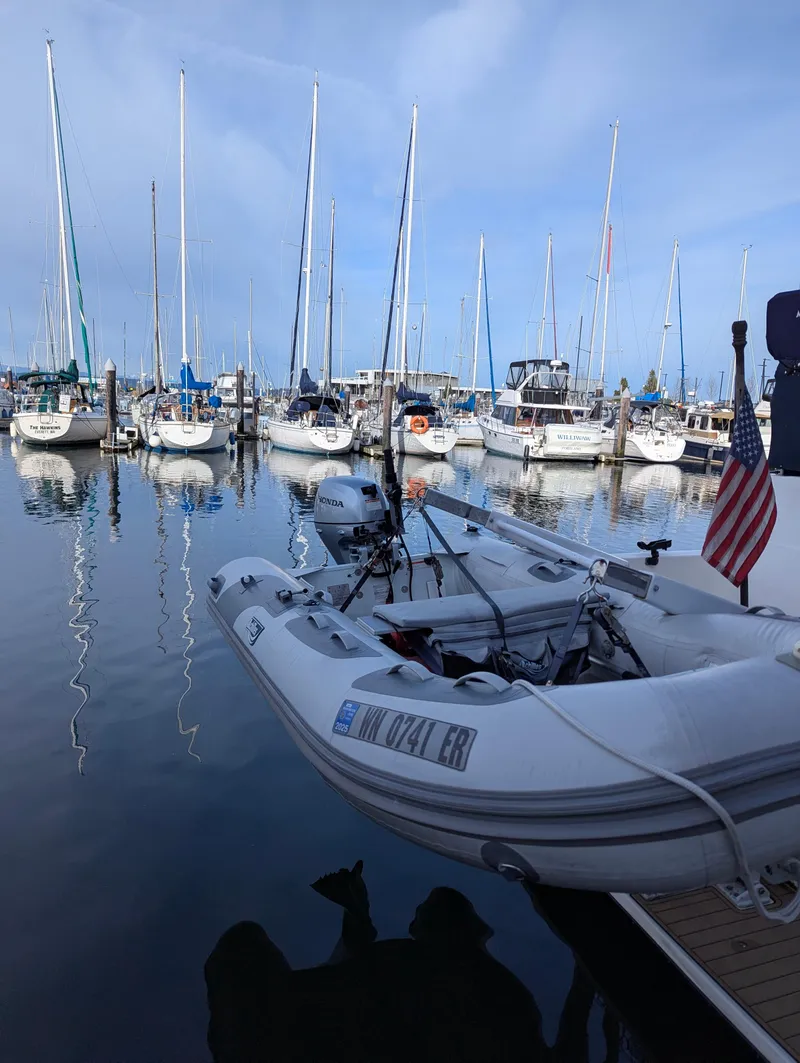 Slide: The Image of Bayliner 4087 Aft Cabin Motoryacht, 2002, docked with sailboats in marina. - 37