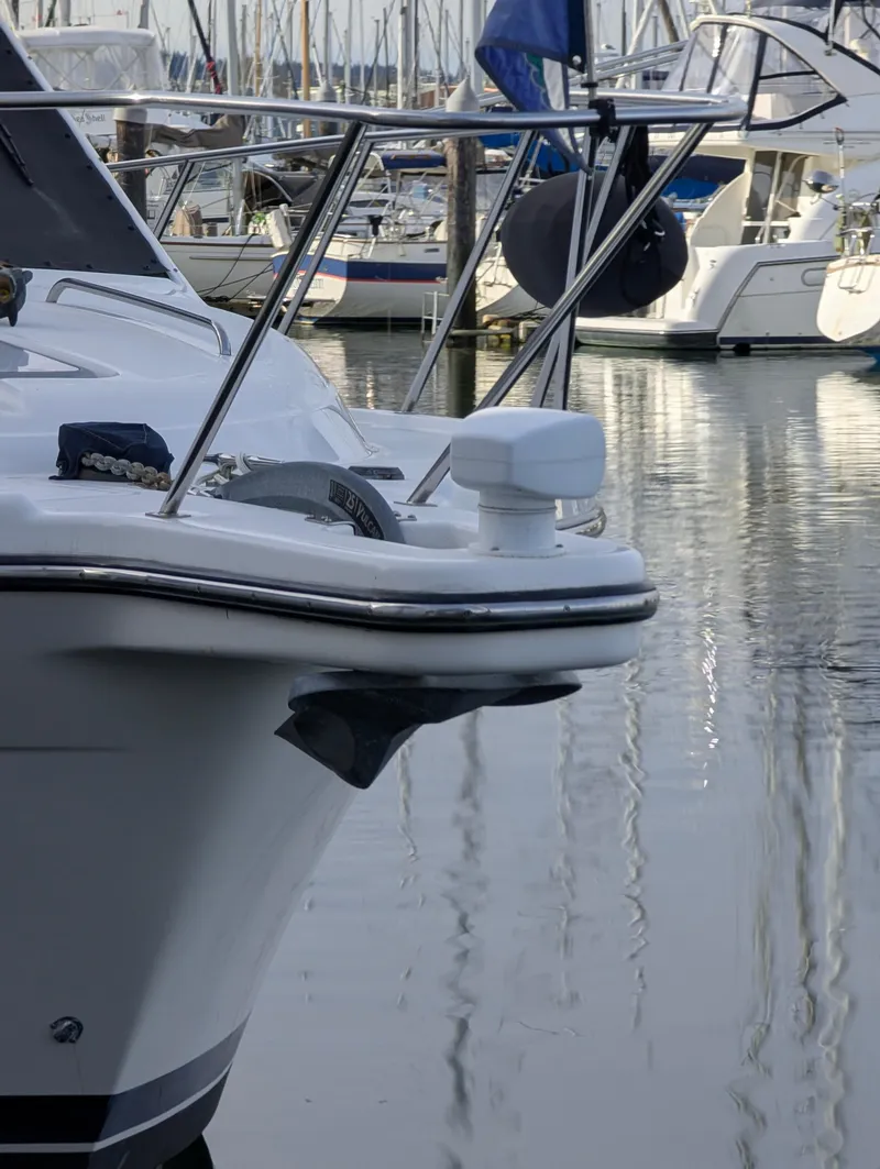 Slide: The Image of 2002 Bayliner 4087 Aft Cabin Motoryacht docked in a marina, surrounded by other boats. - 39