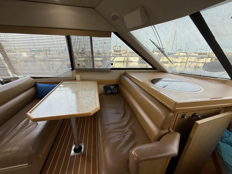 Slide: The Image of Interior of 2002 Bayliner 4087 Aft Cabin Motoryacht with seating and table. - 4
