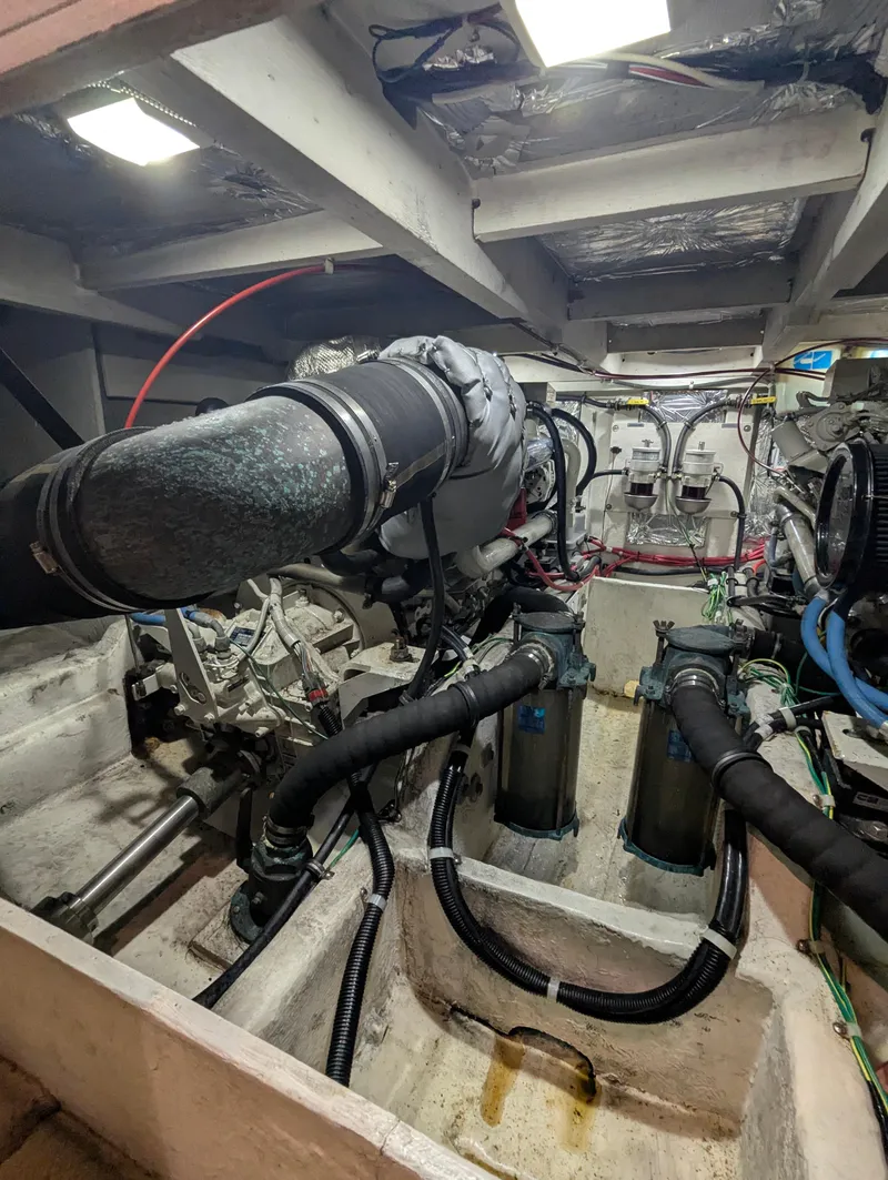 Slide: The Image of Engine room of 2002 Bayliner 4087 Aft Cabin Motoryacht with visible components and wiring. - 42