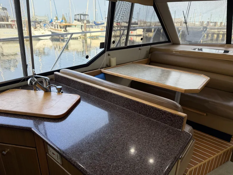 Slide: The Image of Interior of 2002 Bayliner 4087 Aft Cabin Motoryacht with dining area and kitchenette. - 5