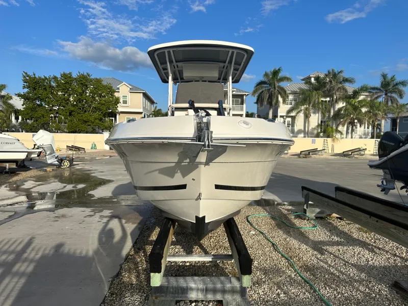Slide: The Image of 2015 Striper 200 Center Console boat on trailer, sunny day, residential background. - 12