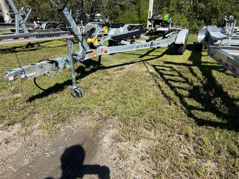 Slide: The Image of Boat trailer for 2015 Striper 200 Center Console on grassy area. - 20