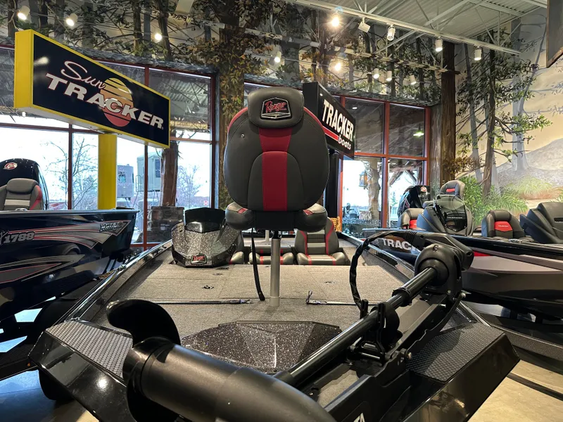 Slide: The Image of 2024 Ranger RT188P boat displayed in showroom with Sun Tracker signage. - 1
