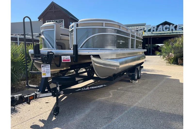 Slide: The Image of 2024 Sun Tracker Party Barge 20 DLX pontoon boat on trailer at dealership. - 56
