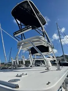 Slide: The Image of 2017 Invincible 39 Open Fisherman boat with tower against blue sky. - 10