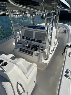 Slide: The Image of 2017 Invincible 39 Open Fisherman boat interior with helm and seating. - 12