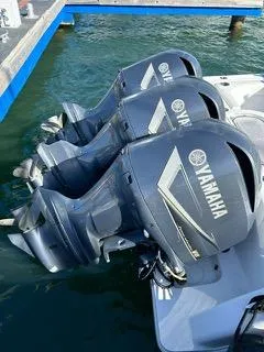 Slide: The Image of 2017 Invincible 39 Open Fisherman with triple Yamaha outboard engines at dock. - 18