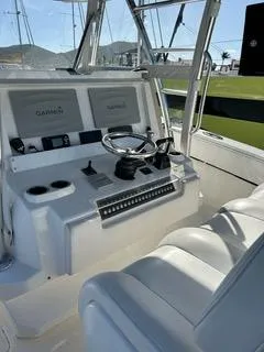 Slide: The Image of 2017 Invincible 39 Open Fisherman boat cockpit with Garmin navigation system. - 2