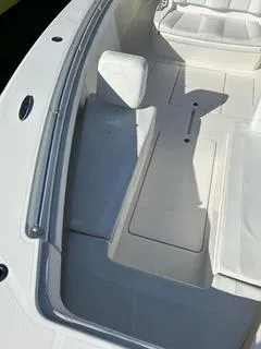 Slide: The Image of 2017 Invincible 39 Open Fisherman boat interior with white seating and deck. - 7