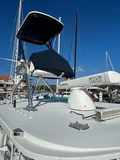 Slide: The Image of 2017 Invincible 39 Open Fisherman boat with radar and canopy, docked in a marina. - 9