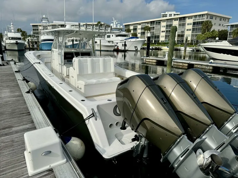Slide: The Image of 2014 Invincible Open Fisherman boat docked with triple outboard engines. - 20