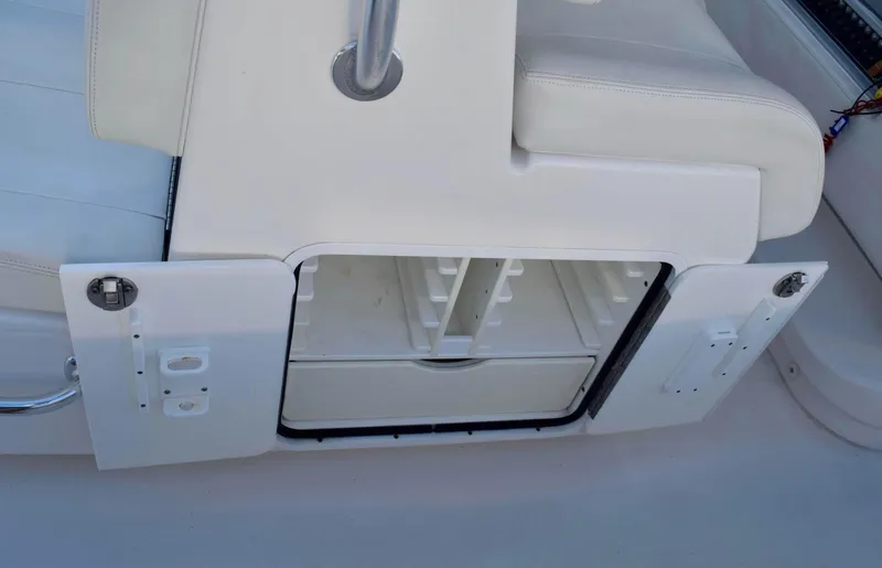 Slide: The Image of 2014 Invincible Open Fisherman boat storage compartment with open doors. - 6