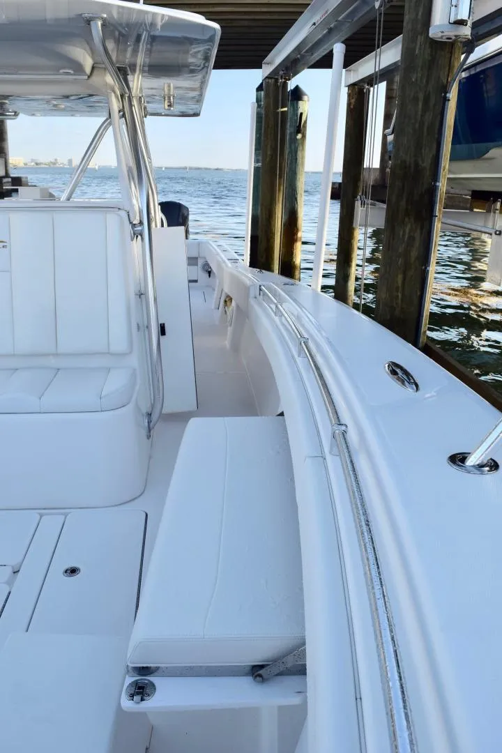 Slide: The Image of 2014 Invincible Open Fisherman boat docked by the water. - 9