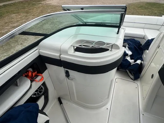 Slide: The Image of 2014 Sea Ray 220 SD Outboard interior with seating and storage compartments. - 12